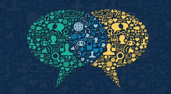 Deux bulles de dialogue composées d'icônes symbolisant la communication et les réseaux sociaux, illustrant la tendance réseaux sociaux.