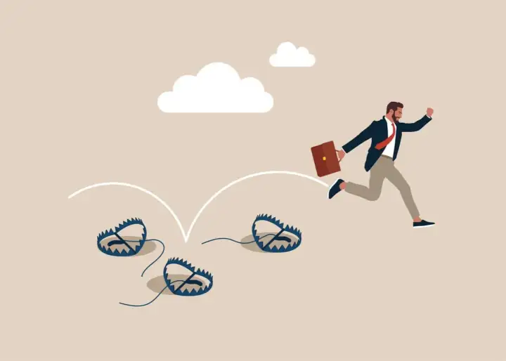 Un homme d'affaires court, évitant des pièges. Un formateur web pourrait utiliser cette image pour illustrer les dangers du parcours entrepreneurial.
